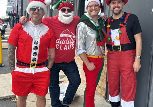 Four adults in festive Christmas costumes